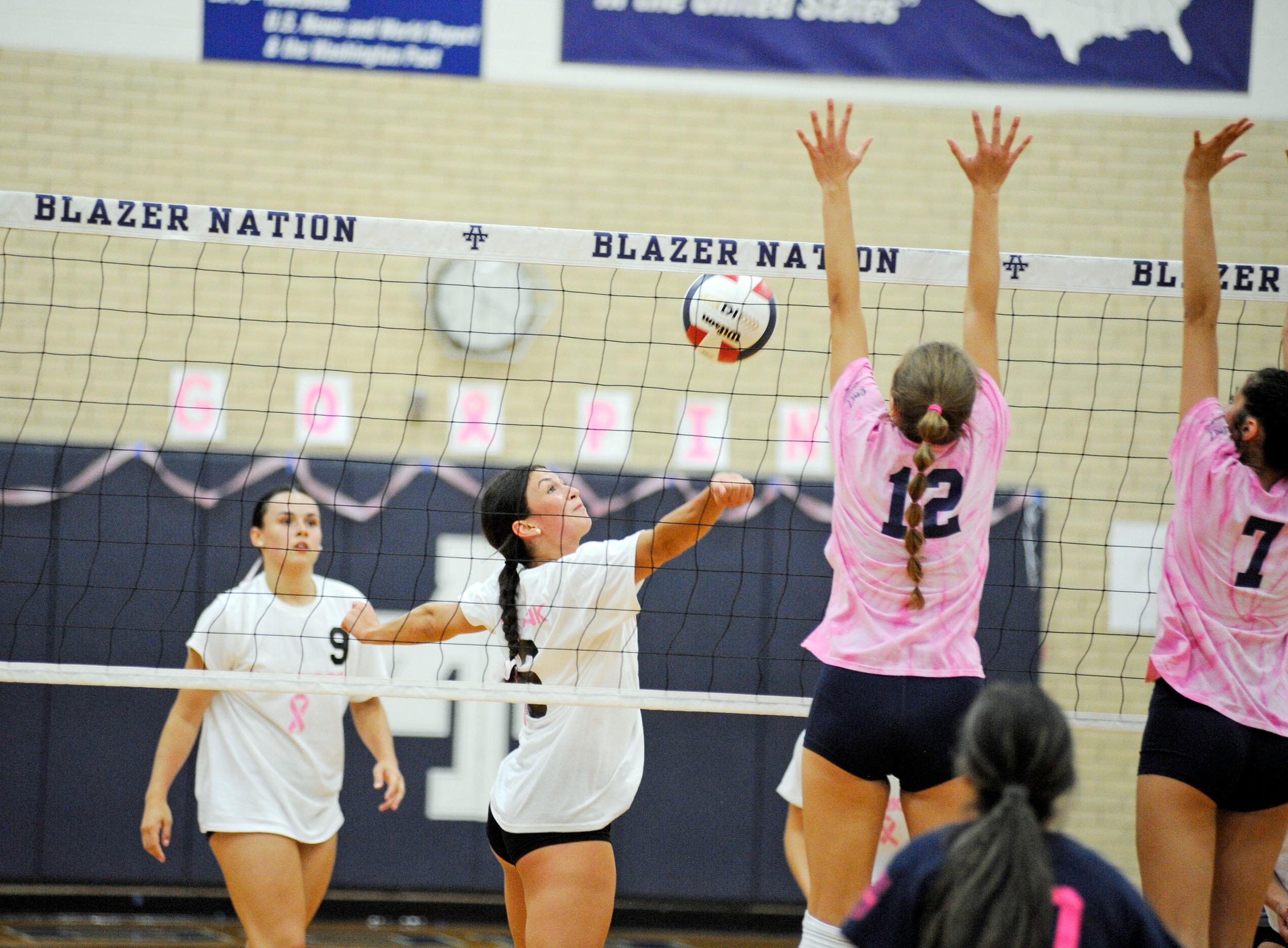 Willowbrook and Addison Trail face off for a cause during District 88’s annual Dig/Go Pink girls volleyball match